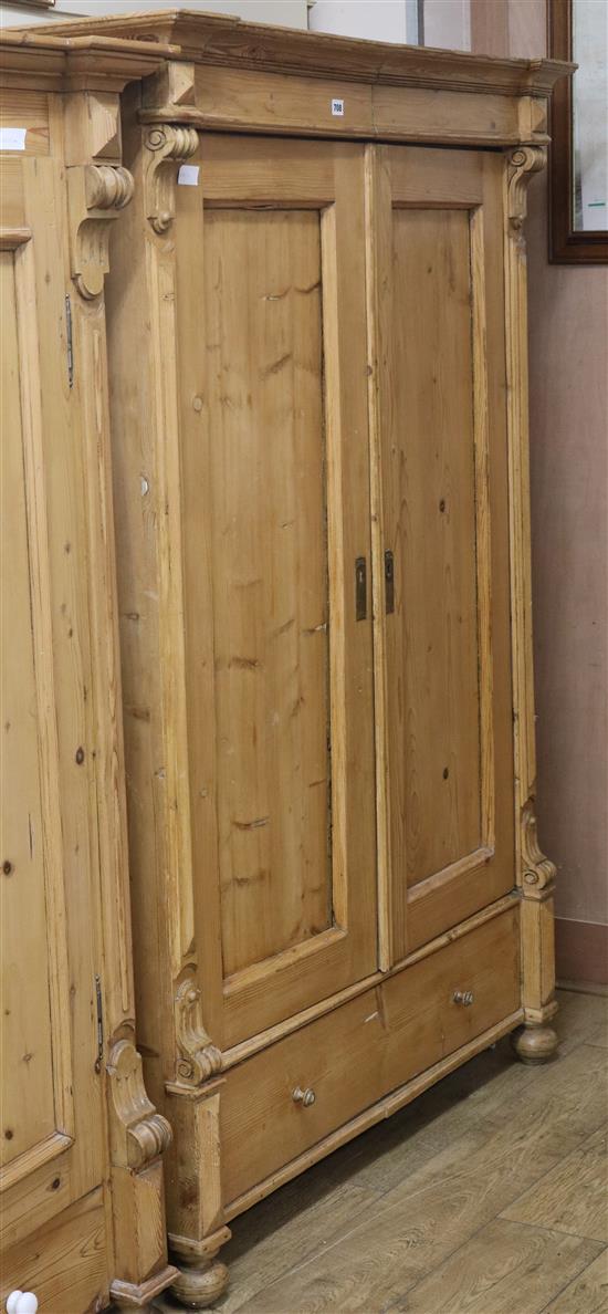 A 19th century French stripped pine two door wardrobe W.122cm